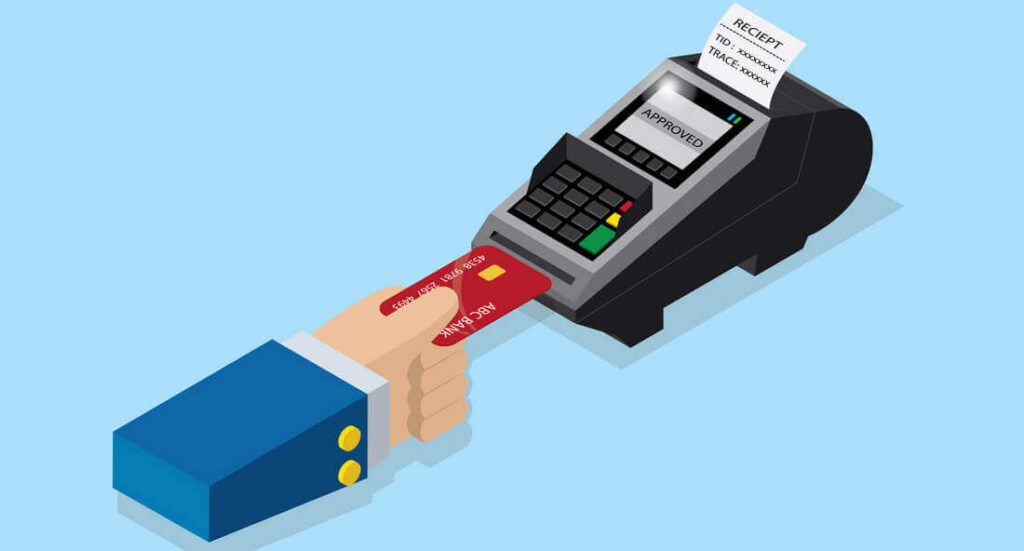 Hand inserting a credit card into a payment terminal, receipt printing, "APPROVED" on screen