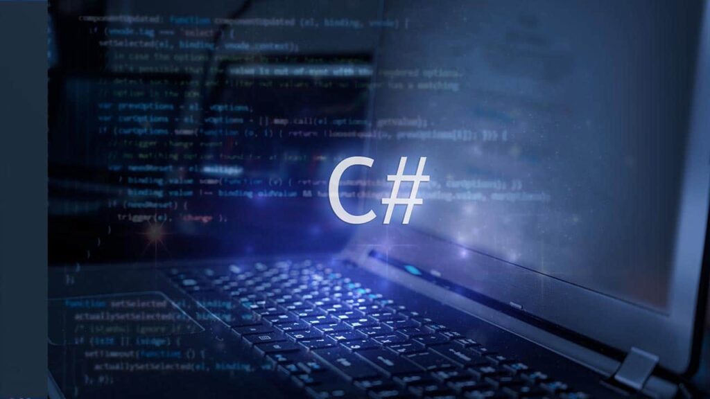 C# logo over a laptop keyboard with code on the screen, representing programming and OCR