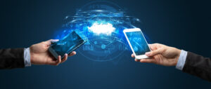 Hands holding smartphones, connected to a cloud with data security graphics