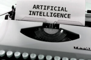 ARTIFICIAL INTELLIGENCE" typed on paper in a vintage typewriter, symbolizing AI technology
